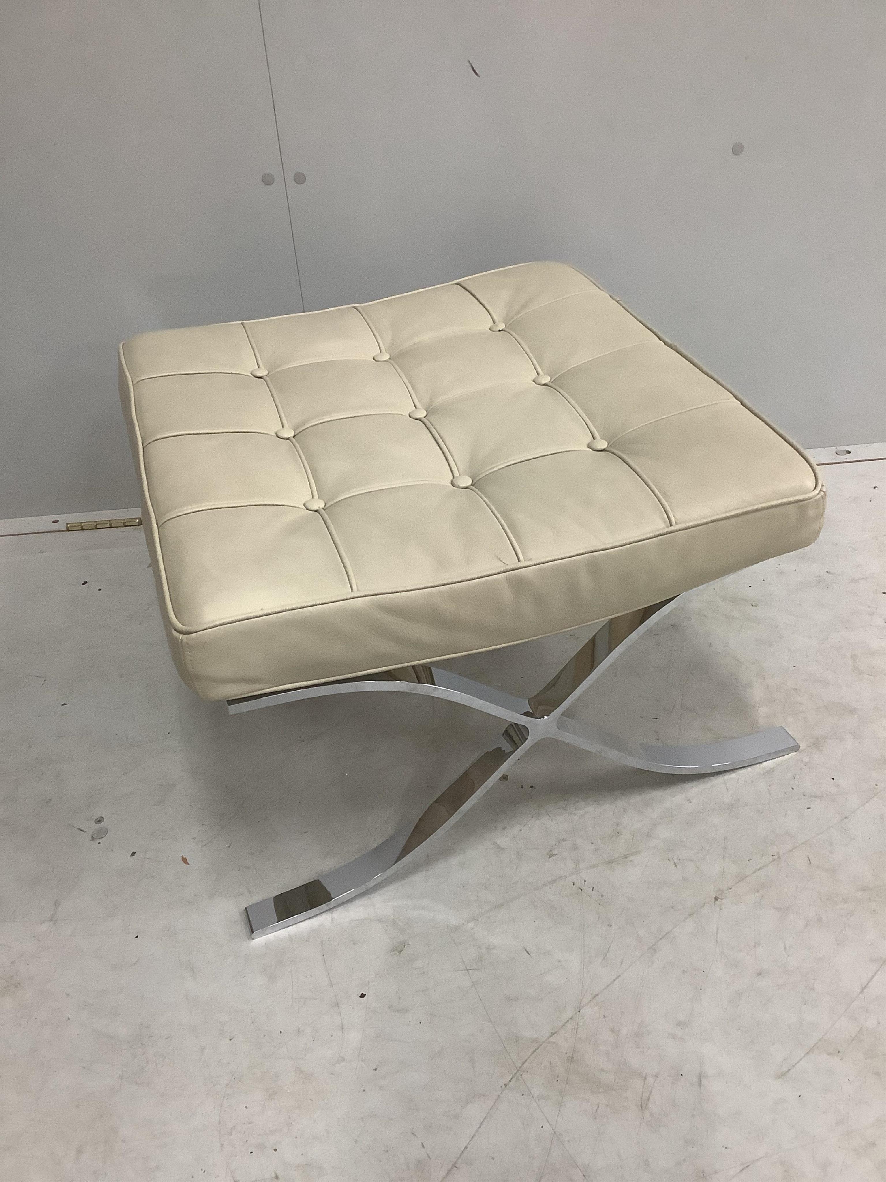 A pair of Barcelona style ivory leather and chrome ottoman stools, width 61cm, depth 58cm, height 36cm. Condition - good